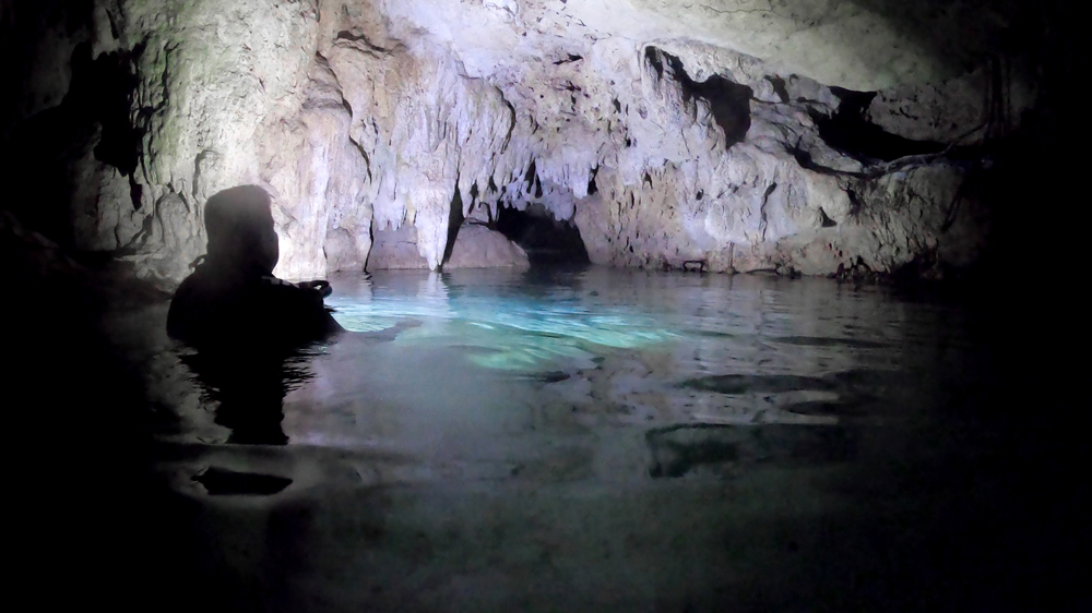 Swimming through the caves at Cenote Sac-Actun